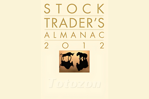 A financial trader analyzing charts and data from the Stock Traders Almanac 1