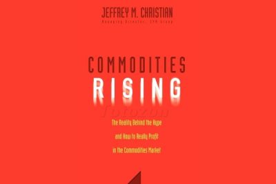 A graph showing rising commodity prices with a background of oil barrels and gold bars.