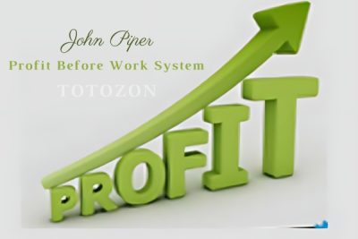 A strategic plan on a desk with charts and graphs representing the Profit Before Work System.