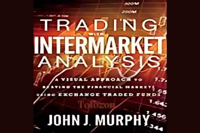 A trader analyzing intermarket relationships on a computer screen, illustrating John Murphy's techniques.