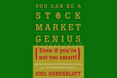 An investor analyzing stock market charts embodying the principles of Joel Greenblatts strategies