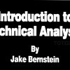 Chart patterns and indicators on a monitor as explained by Jake Bernstein.