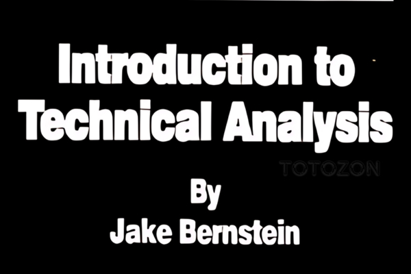 Chart patterns and indicators on a monitor as explained by Jake Bernstein.