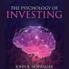 Investor analyzing charts and data, representing the psychological aspects of investing.