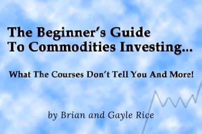 An informative guide open on a table, illustrating various commodities like gold, oil, and grains, reflecting investment strategies and market analysis.