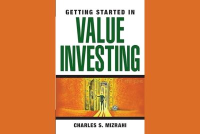 Charles Mizrahi discussing value investing strategies at a financial seminar