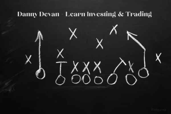 Danny Devan teaching investing and trading concepts to a group of learners on his platform.