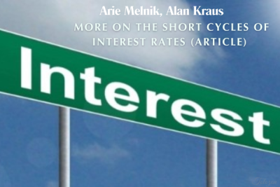 Image of economists Arie Melnik and Alan Kraus discussing charts showing interest rate trends.