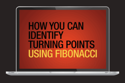 A trader analyzing Fibonacci retracement levels on a financial chart to identify potential market turning points