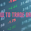 A trader analyzing market gaps on a computer screen with charts and data