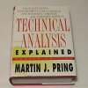 A trader analyzing market trends using Martin Pring's technical analysis tools