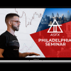 A trader studying the ASFX Seminar Replay and PDF Study Guide on a laptop