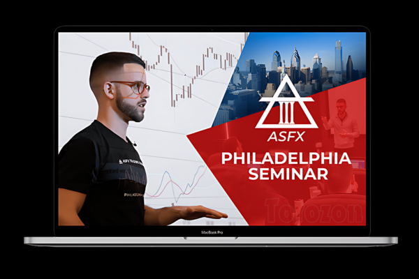 A trader studying the ASFX Seminar Replay and PDF Study Guide on a laptop