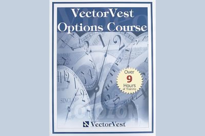 A trader using the VectorVest options course materials, with a CD and PDF workbook on a desk.