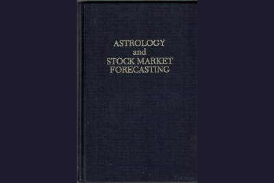 Astrologer analyzing stock market charts with celestial overla image