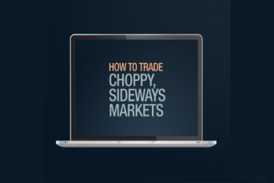 Trader analyzing market trends using Elliott Wave Theory on a computer screen