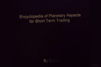 Trader analyzing planetary aspects for market trading on a computer screen