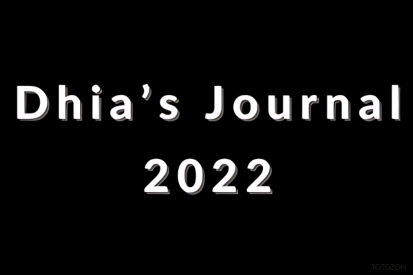 An open journal with handwritten entries, symbolizing the personal reflections and growth captured in Dhia’s Journal 2022